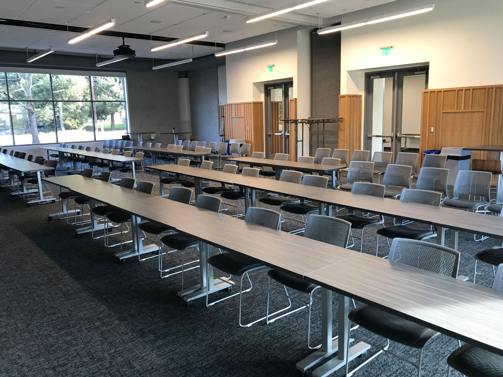 Rows of chairs and tables in a Harmony campus community room