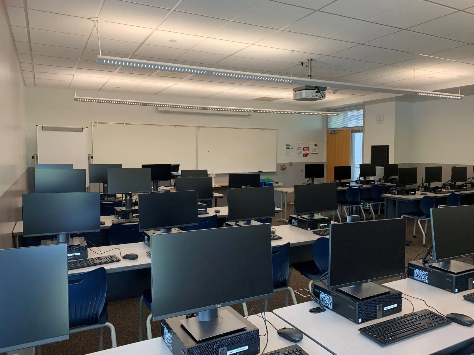 Angled close-up of rows of computers on desks in Wilsonville's Computer Lab W211